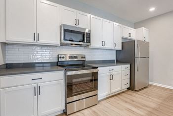 Kitchen with White Cabinetry and Stainless Steel Appliances